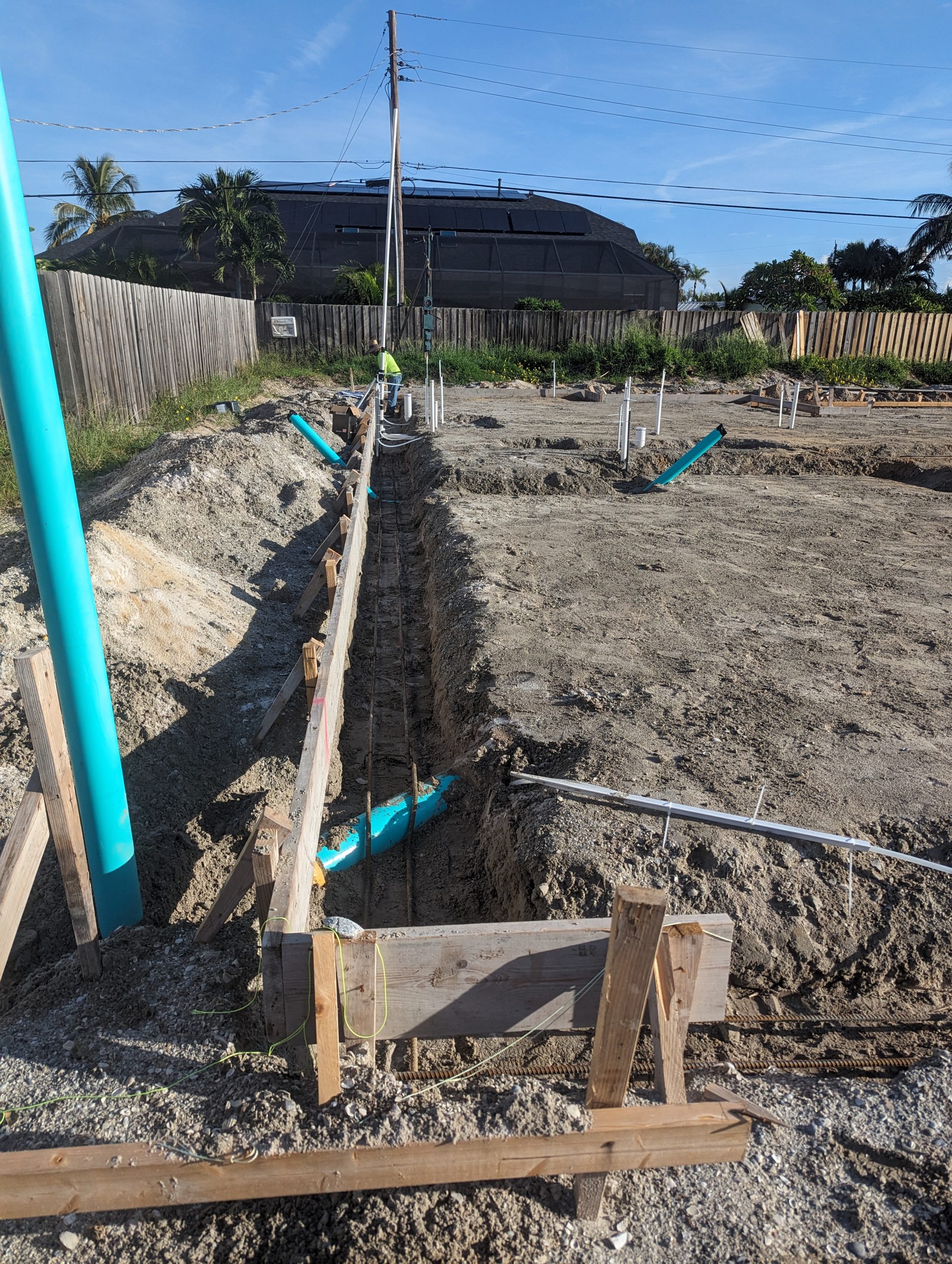 Showing the width of the footer and where the sewer line runs out of the house